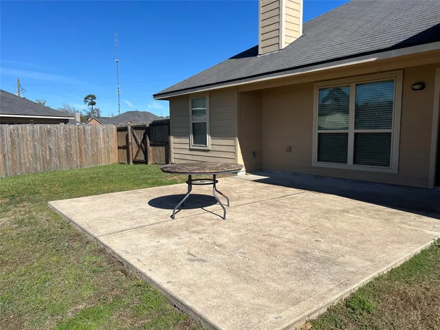 a house view with a backyard space