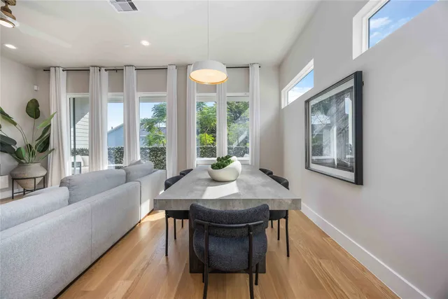 a view of a dining room with furniture window and outside view