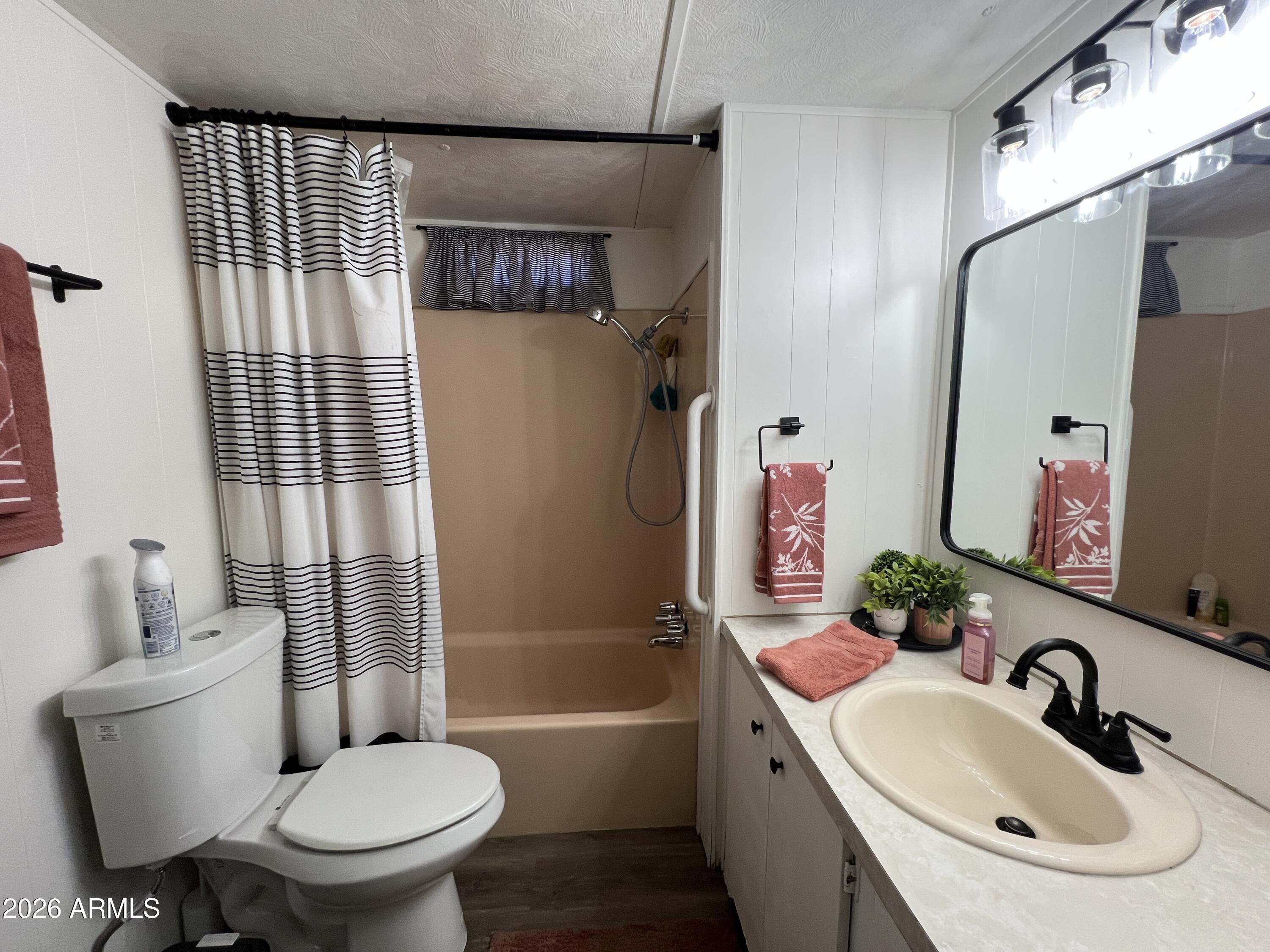 19225 North Cave Creek Road, Unit 40 Phoenix, AZ 85024 - Photo 13 of 21 a bathroom with a sink toilet and shower