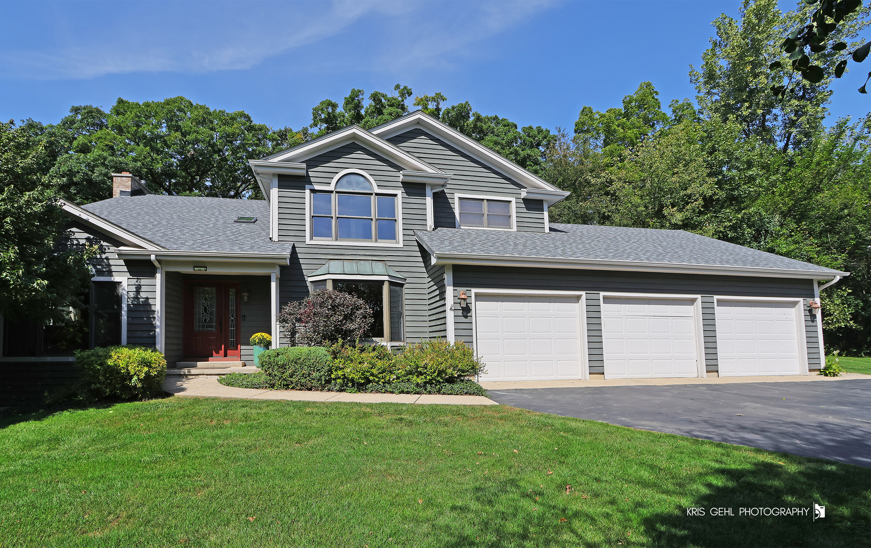 117 West Stone Marsh Lane North Barrington, IL 60010 - Photo 1 of 44 a front view of a house with a yard and garage