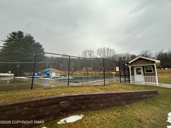a view of a swimming pool with a patio