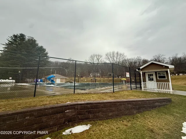 a view of a swimming pool with a patio