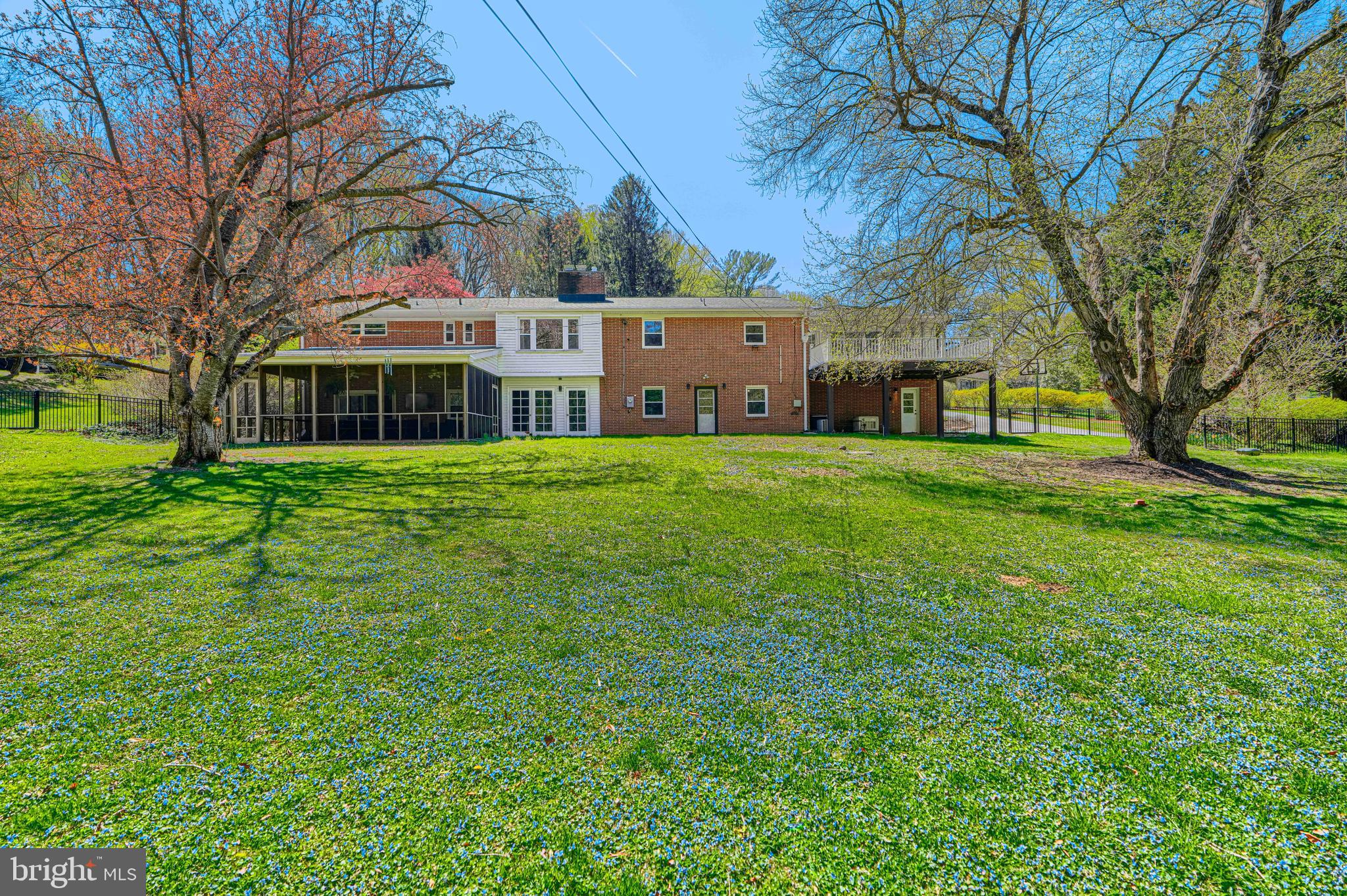 802 Stone Barn Road Towson, MD 21286 - Photo 102 of 104 a view of a house next to a big yard and large trees