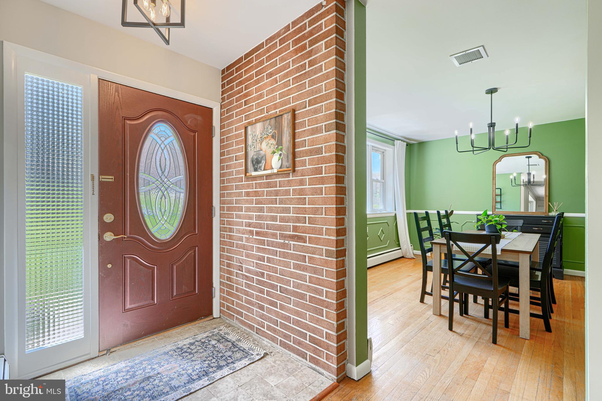 802 Stone Barn Road Towson, MD 21286 - Photo 15 of 104 a view of a dining room with furniture and wooden floor
