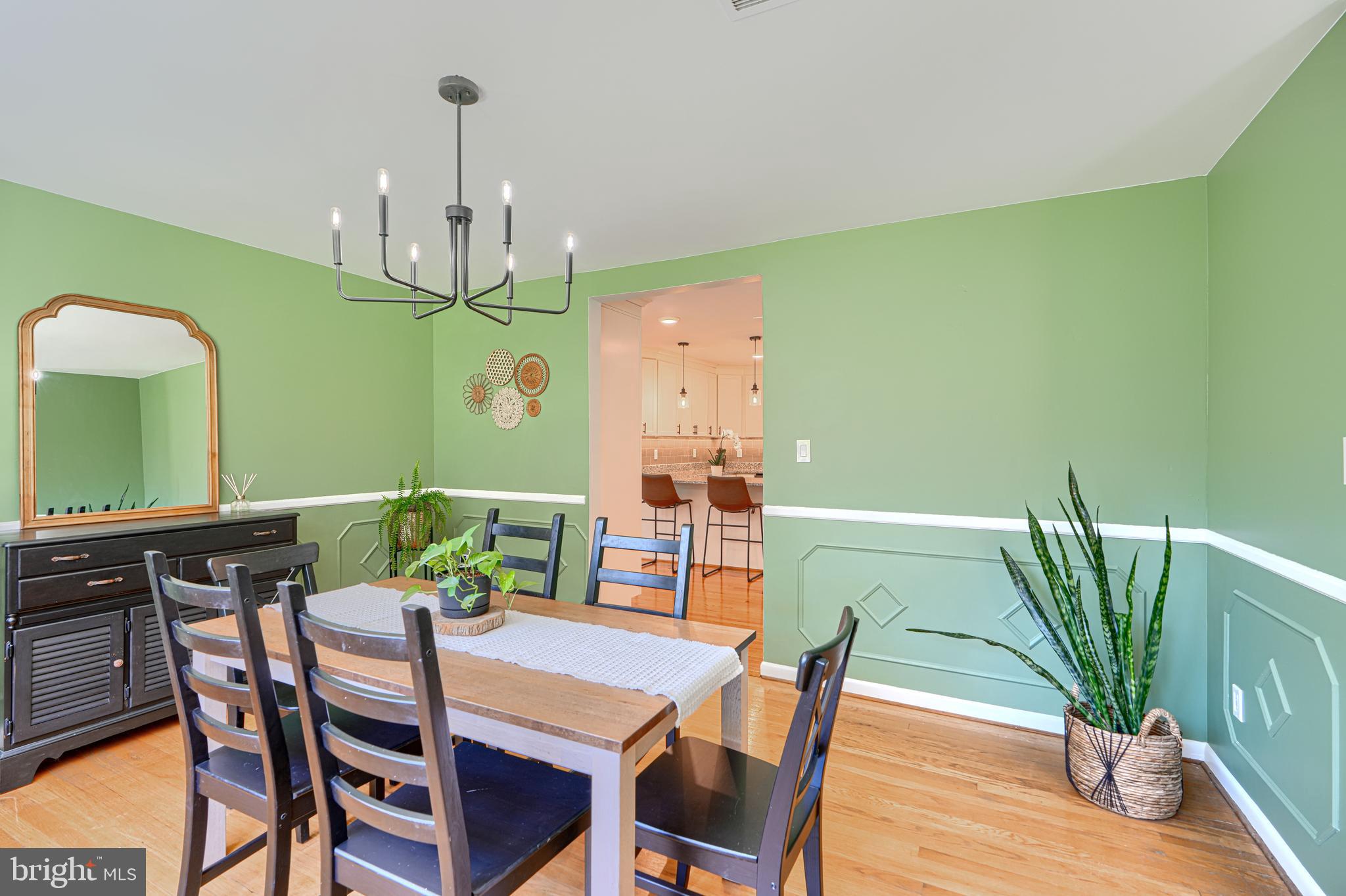 802 Stone Barn Road Towson, MD 21286 - Photo 27 of 104 a view of a dining room with furniture and wooden floor