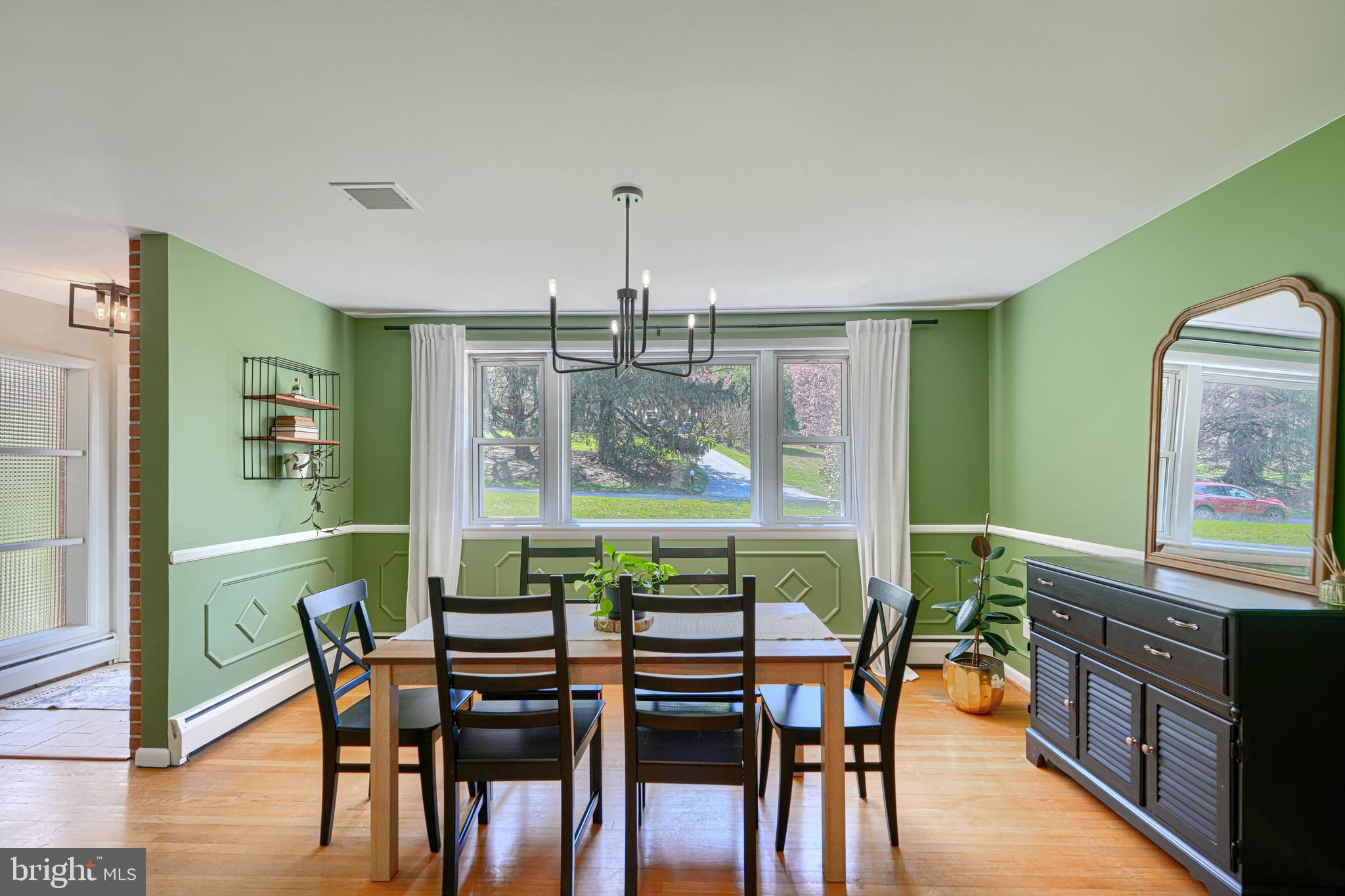 802 Stone Barn Road Towson, MD 21286 - Photo 31 of 104 a view of a dining room with furniture window and wooden floor