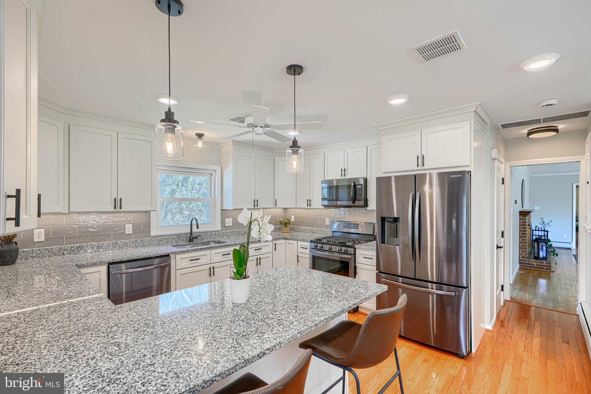 802 Stone Barn Road Towson, MD 21286 - Photo 38 of 104 a kitchen with refrigerator and chairs