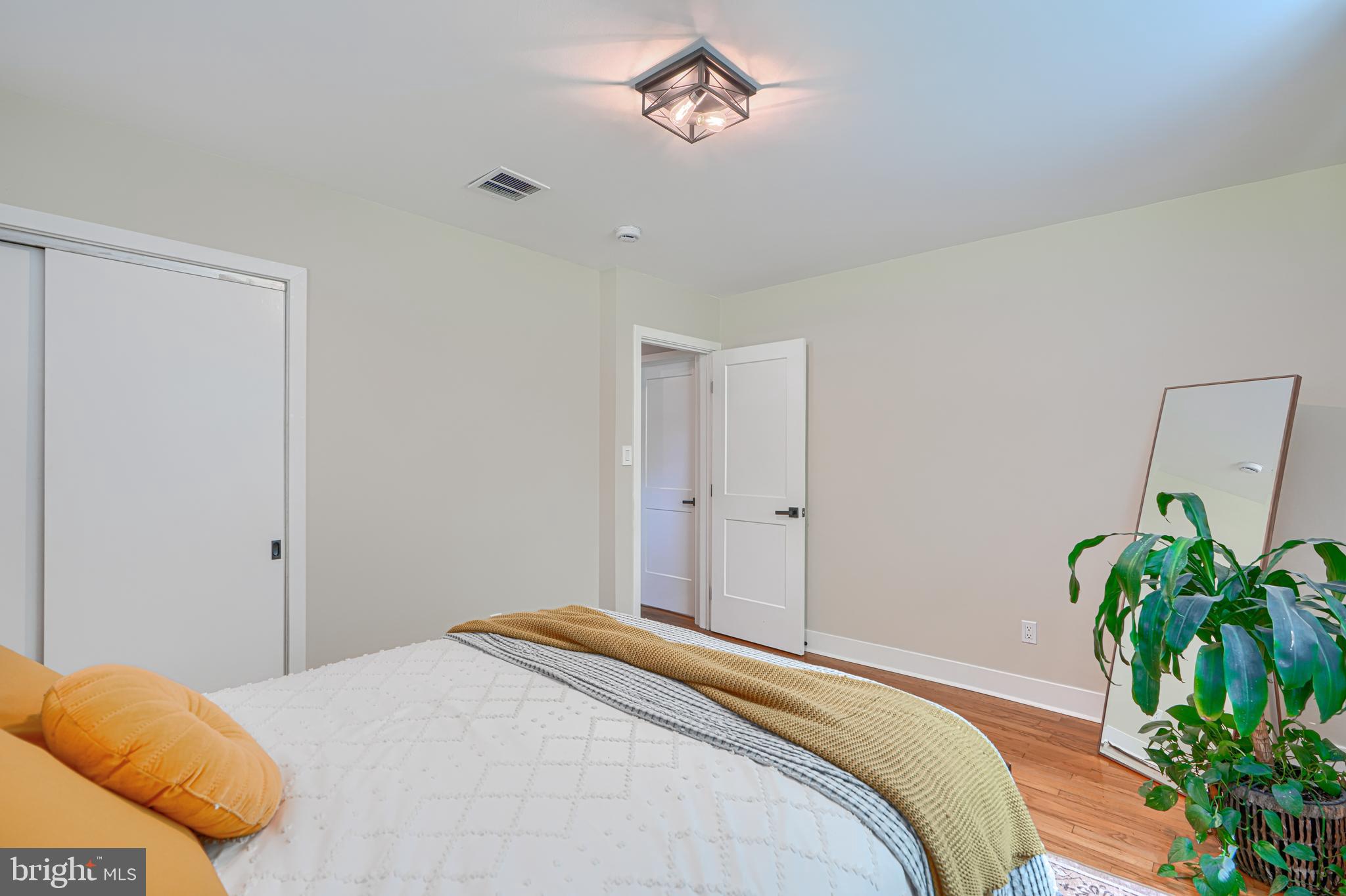 802 Stone Barn Road Towson, MD 21286 - Photo 62 of 104 a bedroom with a bed potted plant and a window