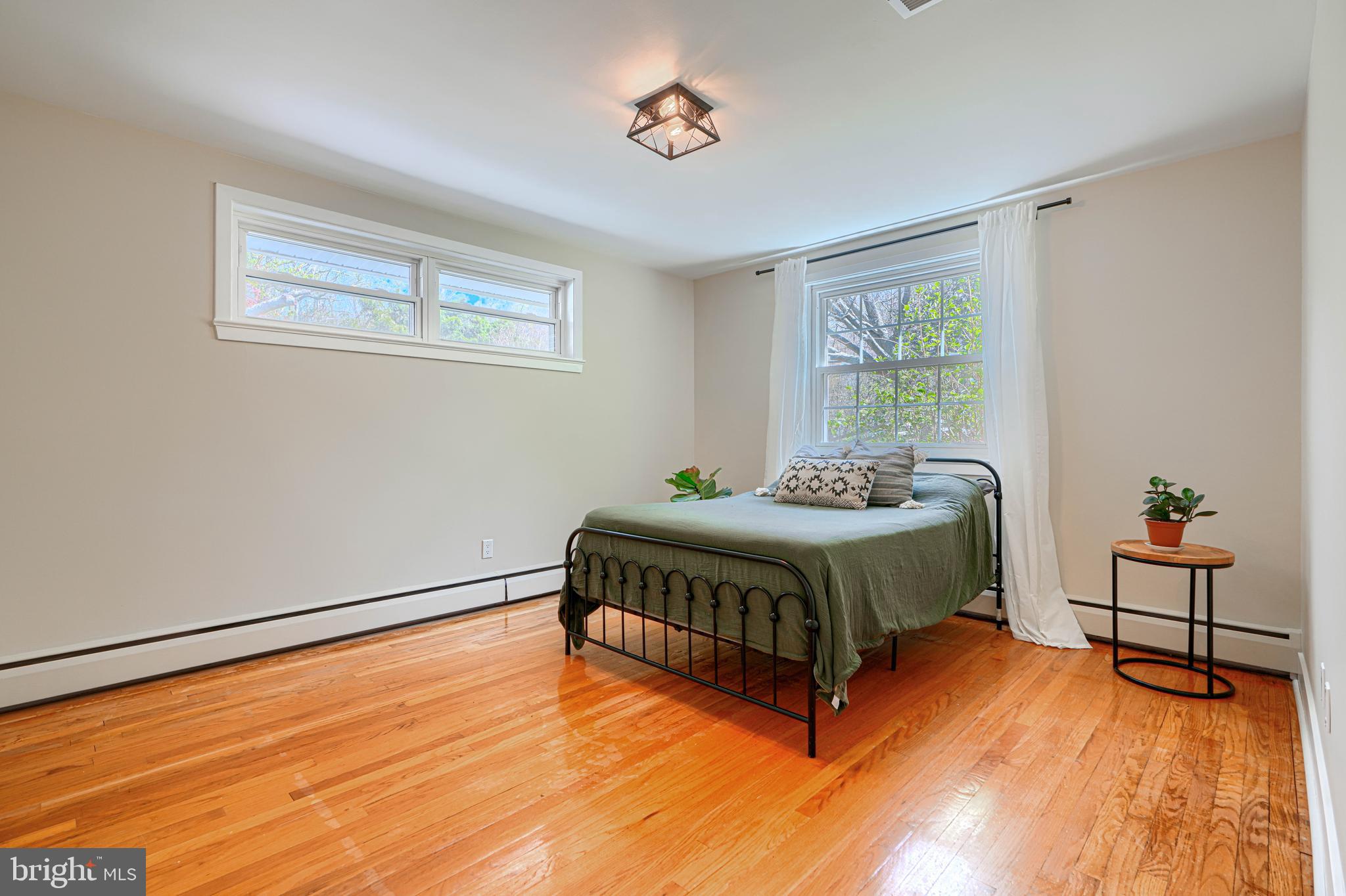 802 Stone Barn Road Towson, MD 21286 - Photo 66 of 104 a spacious bedroom with a bed and window