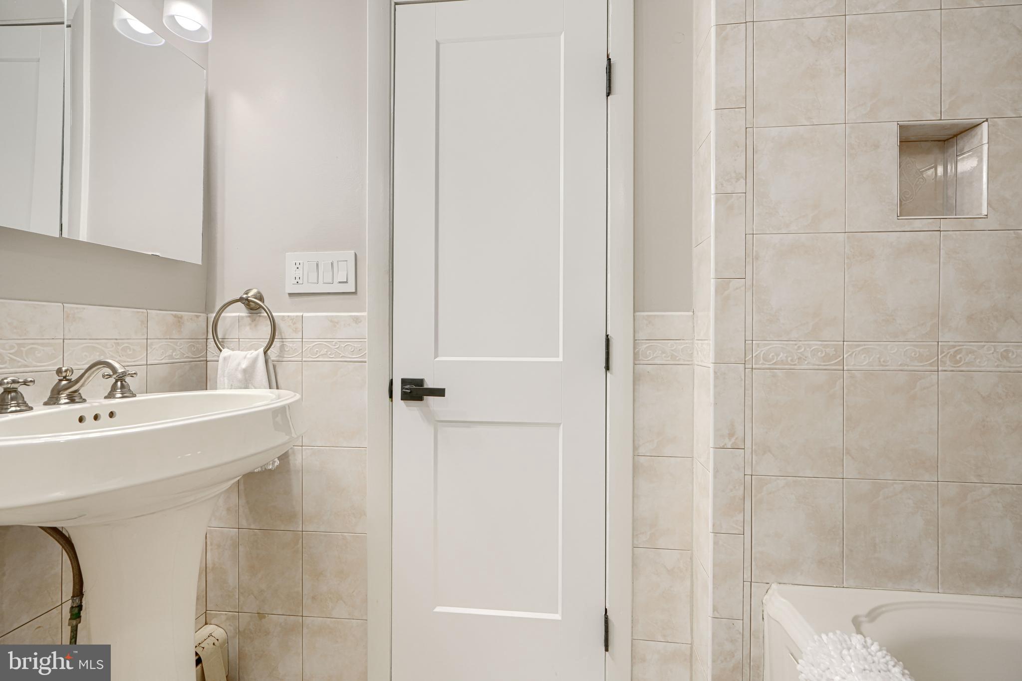 802 Stone Barn Road Towson, MD 21286 - Photo 71 of 104 a bathroom with a sink and mirror
