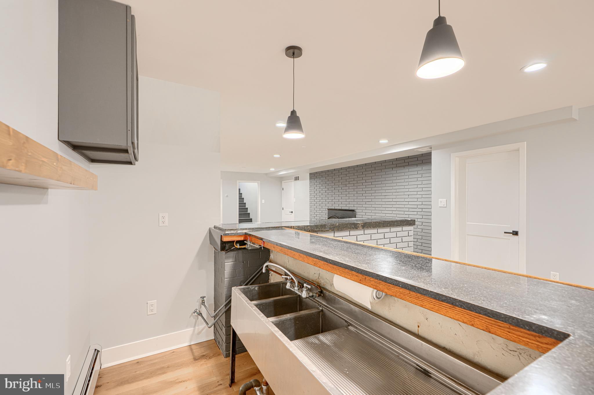 802 Stone Barn Road Towson, MD 21286 - Photo 78 of 104 a kitchen with stainless steel appliances granite countertop a sink and a refrigerator
