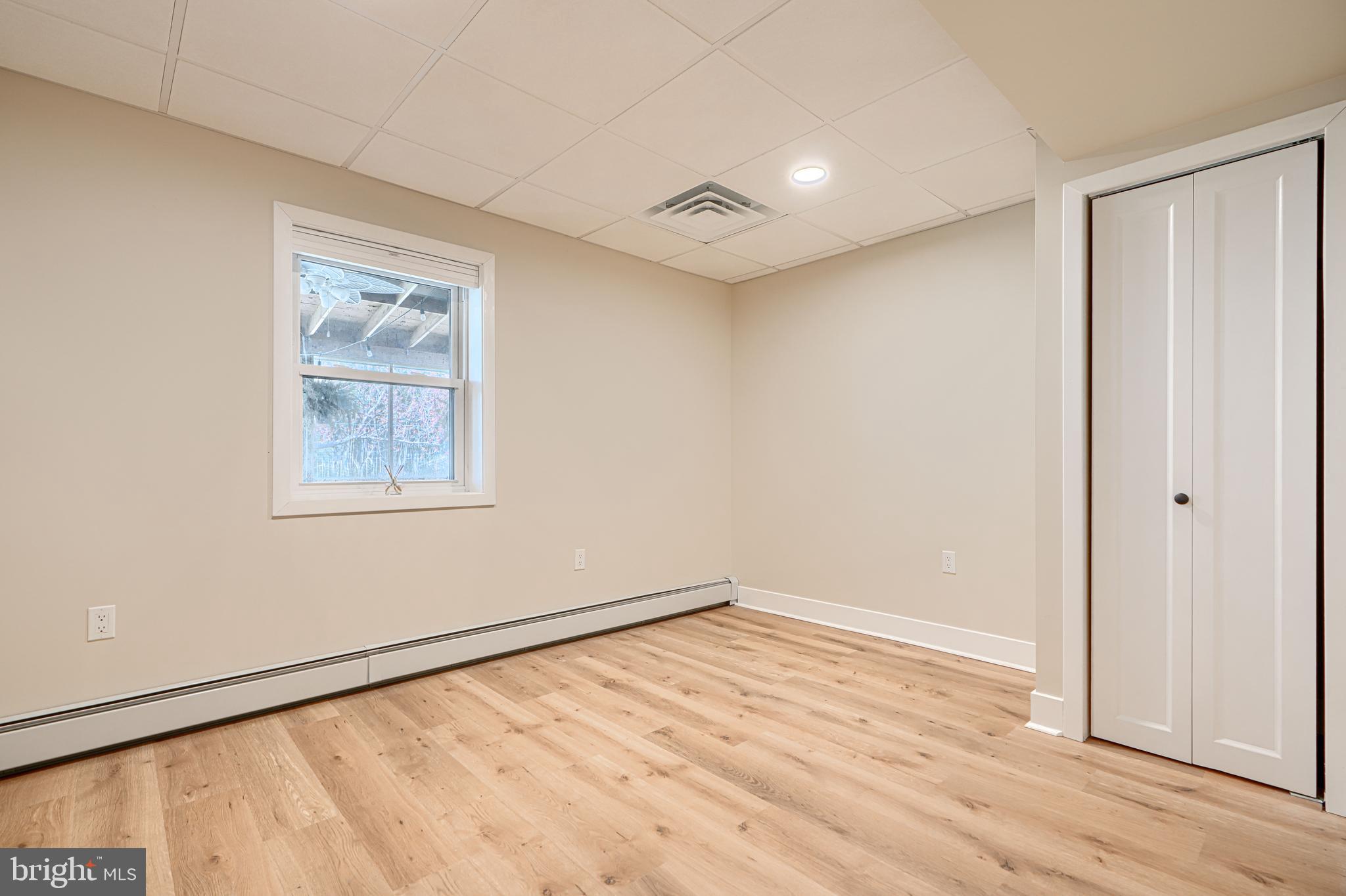802 Stone Barn Road Towson, MD 21286 - Photo 84 of 104 an empty room with wooden floor and windows