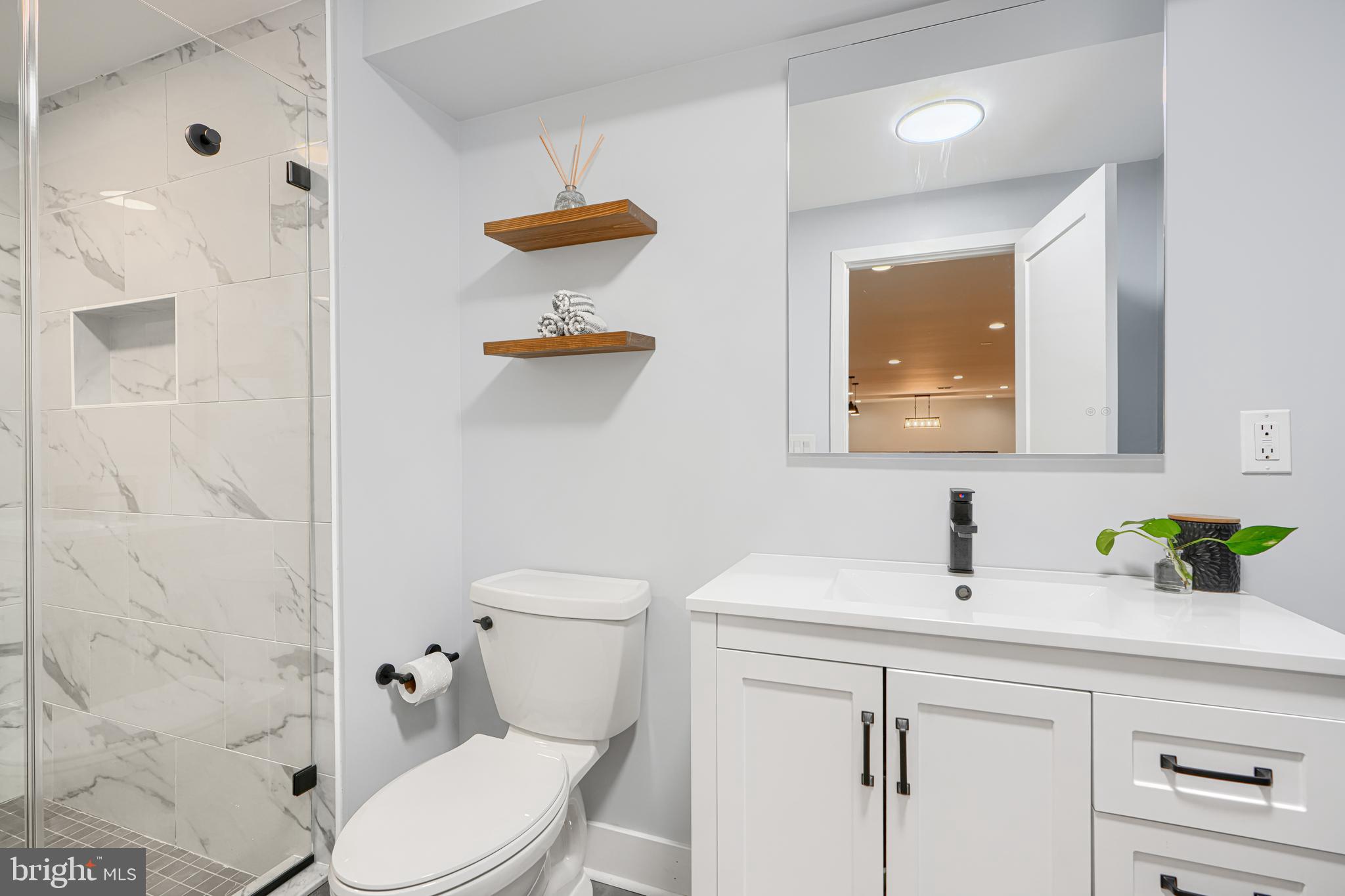 802 Stone Barn Road Towson, MD 21286 - Photo 87 of 104 a bathroom with a sink a toilet and shower