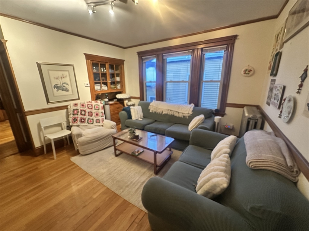 33 Iroquois Street, Unit 2 Boston, MA 02120 - Photo 1 of 14 a living room with furniture and a window