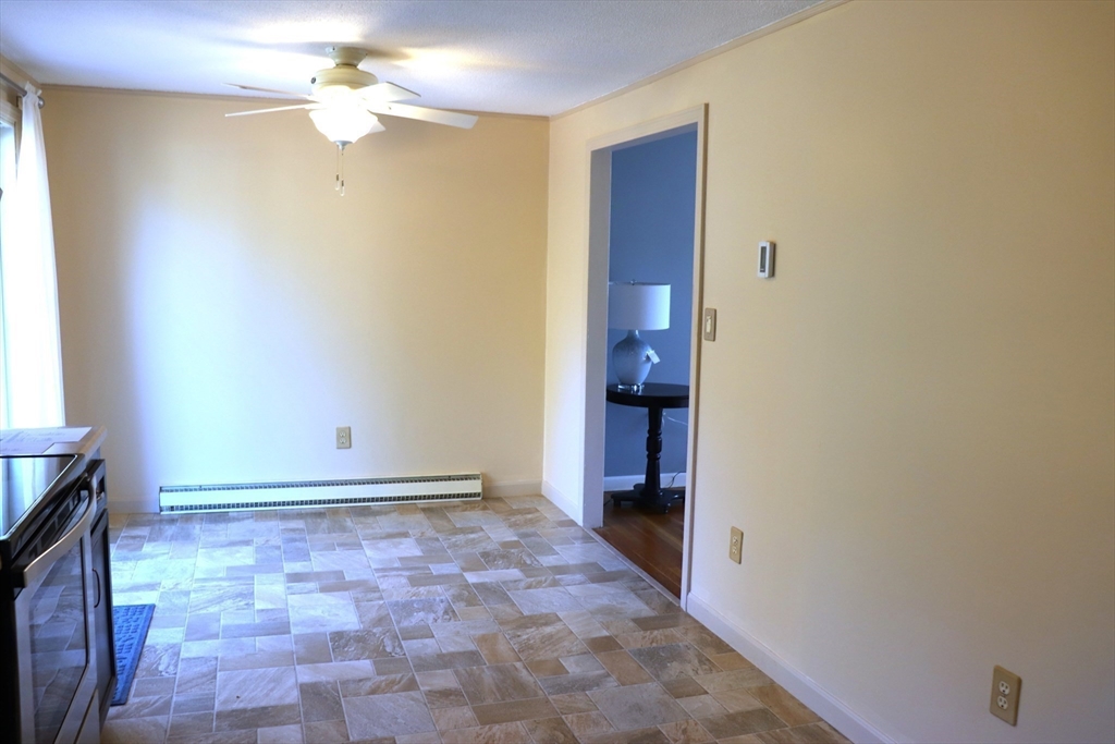 75 Garrison Road Chelmsford, MA 01824 - Photo 13 of 28 a view of a hallway with a chandelier fan and windows