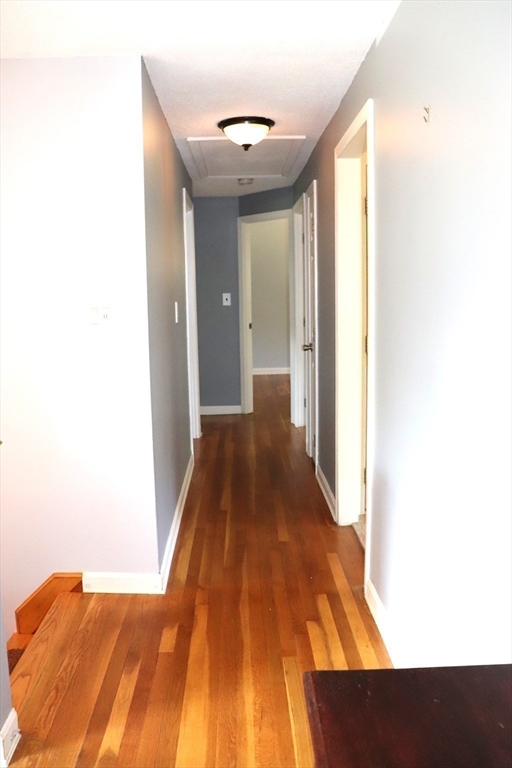 75 Garrison Road Chelmsford, MA 01824 - Photo 16 of 28 a view of a hallway with wooden floor
