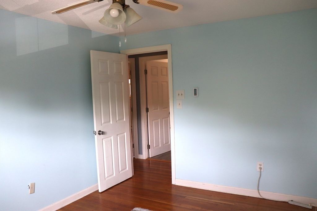 75 Garrison Road Chelmsford, MA 01824 - Photo 18 of 28 a view of a hallway with wooden floor