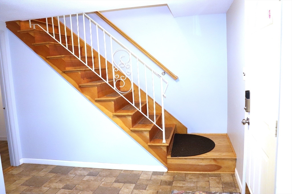 75 Garrison Road Chelmsford, MA 01824 - Photo 2 of 28 a house view with staircase and white walls