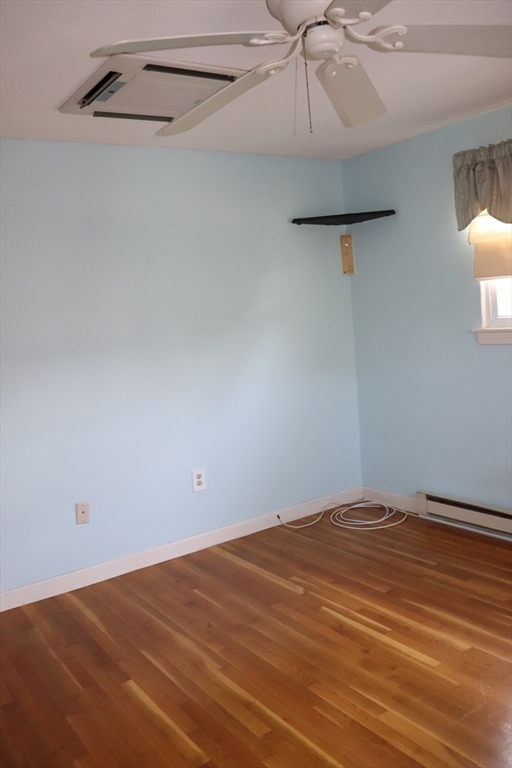 75 Garrison Road Chelmsford, MA 01824 - Photo 21 of 28 a view of a room with an empty space and a ceiling fan