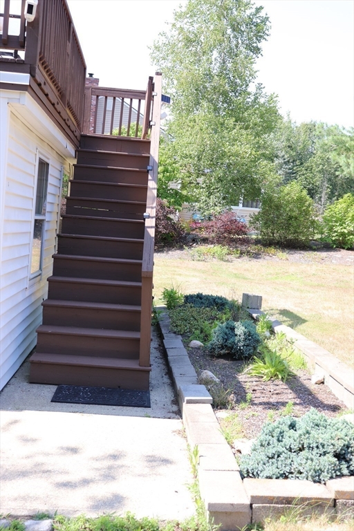 75 Garrison Road Chelmsford, MA 01824 - Photo 25 of 28 a view of a backyard with stairs