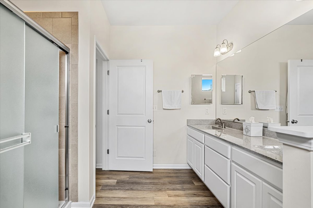 2220 Tyler Trail McHenry, IL 60051 - Photo 11 of 24 a spacious bathroom with a granite countertop sink mirror and double