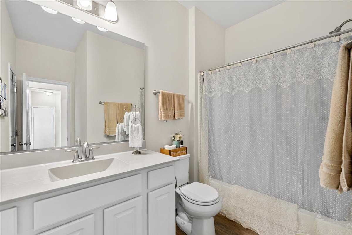 2220 Tyler Trail McHenry, IL 60051 - Photo 14 of 24 a bathroom with a sink toilet and shower