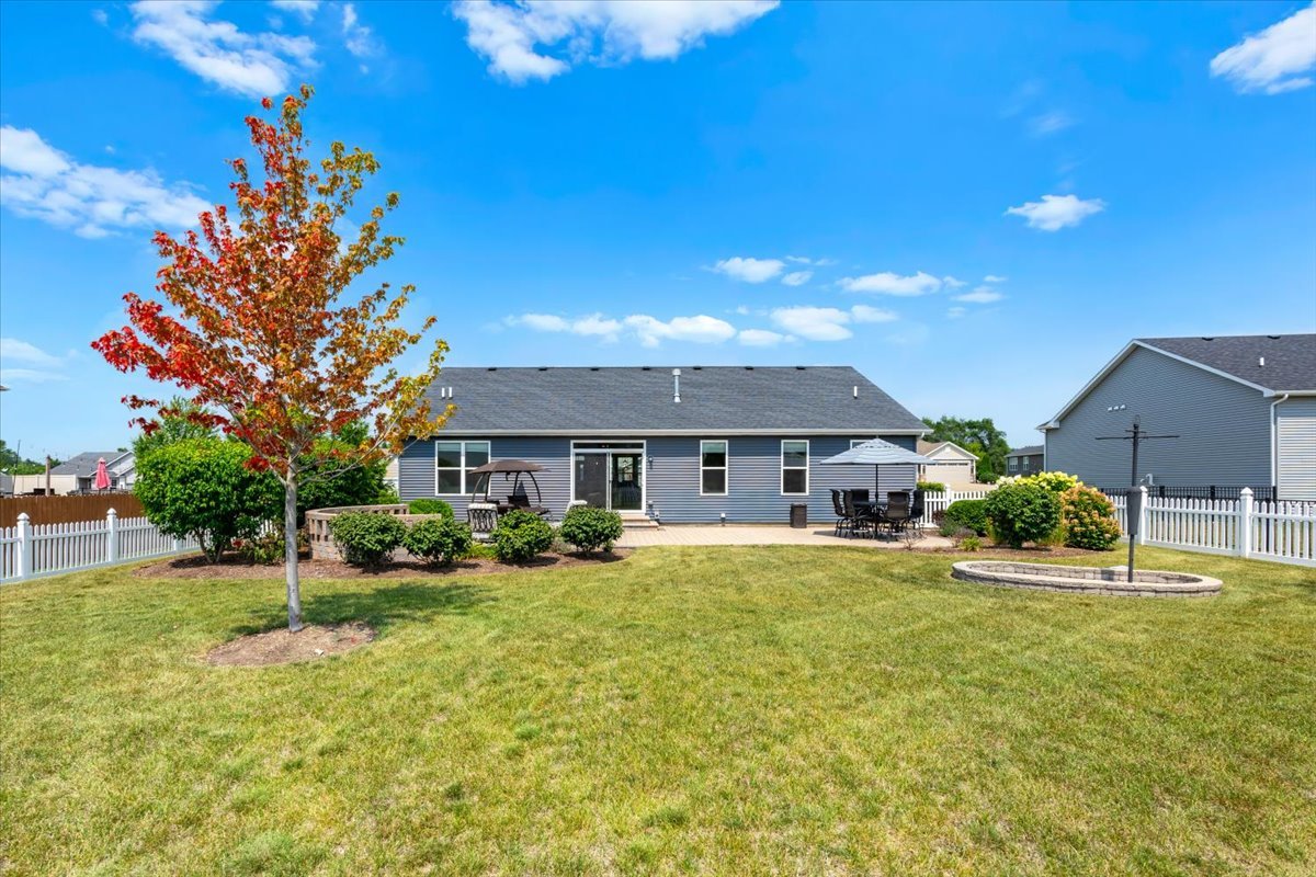 2220 Tyler Trail McHenry, IL 60051 - Photo 19 of 24 a view of a house with a big yard and large tree