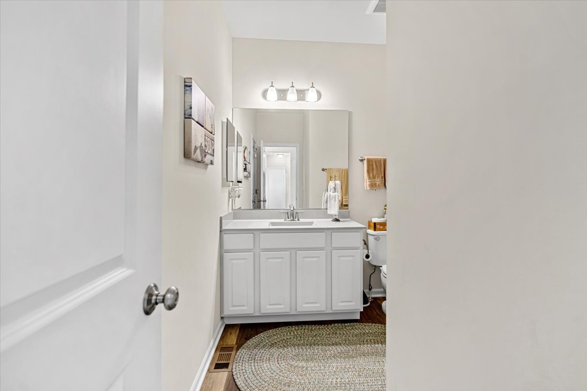2220 Tyler Trail McHenry, IL 60051 - Photo 7 of 24 a bathroom with a sink vanity and mirror