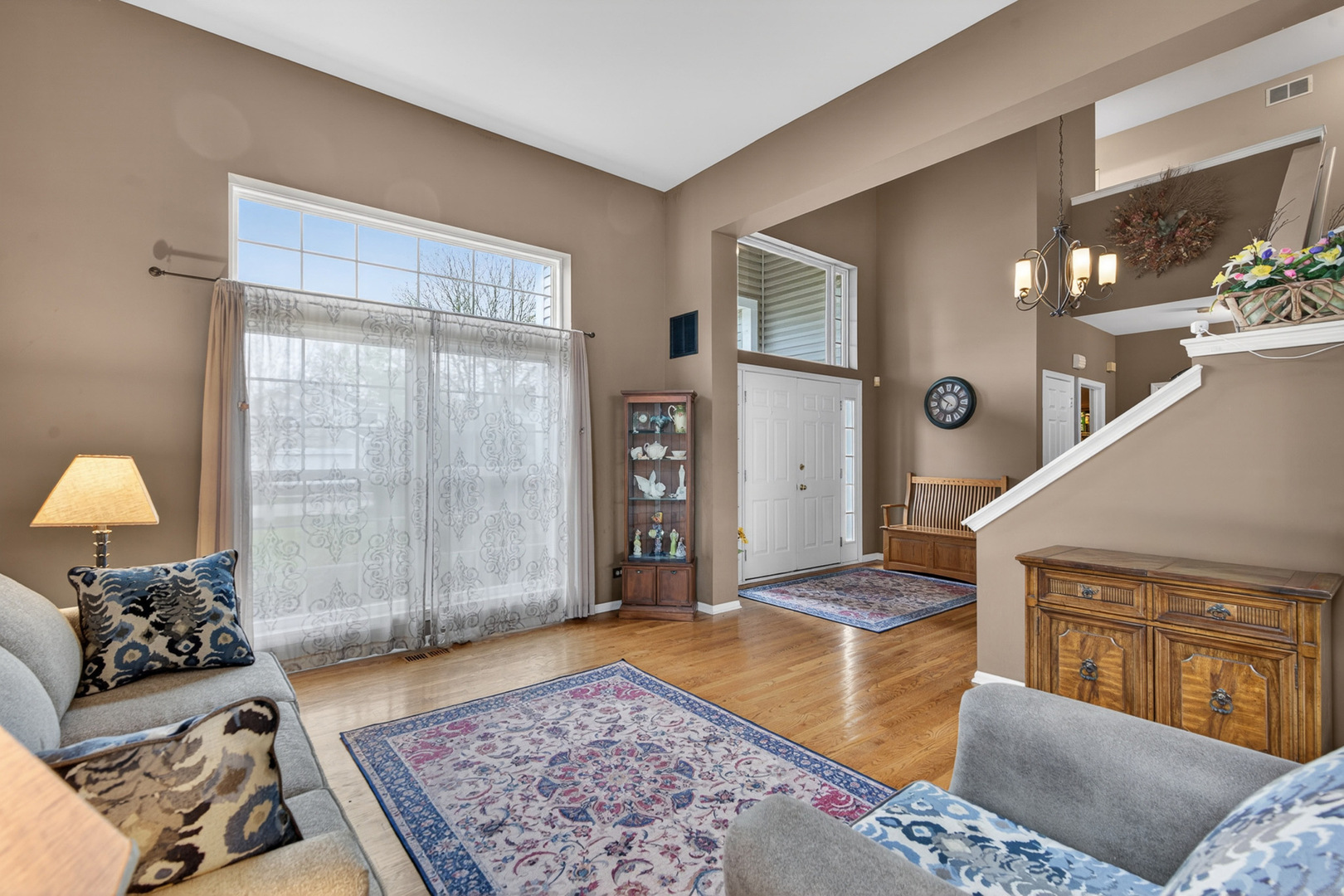 1160 Heavens Gate Lake In The Hills, IL 60156 - Photo 12 of 49 a living room with furniture and a rug