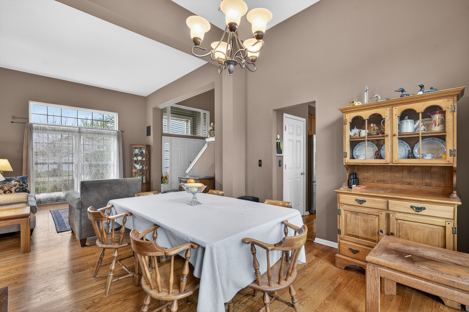 1160 Heavens Gate Lake In The Hills, IL 60156 - Photo 15 of 49 a view of a dining room with furniture and wooden floor