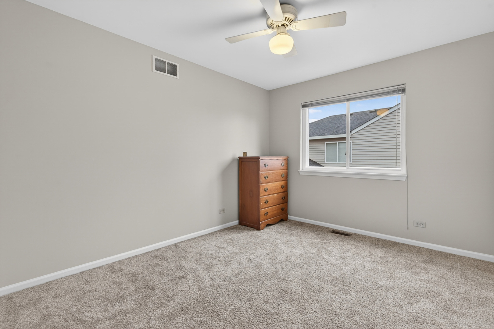 1160 Heavens Gate Lake In The Hills, IL 60156 - Photo 32 of 49 an empty room with windows and ceiling fan