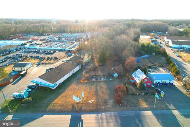 an aerial view of a houses with a yard