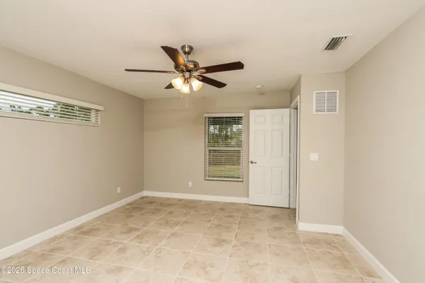 a view of a big room with wooden floor and closet