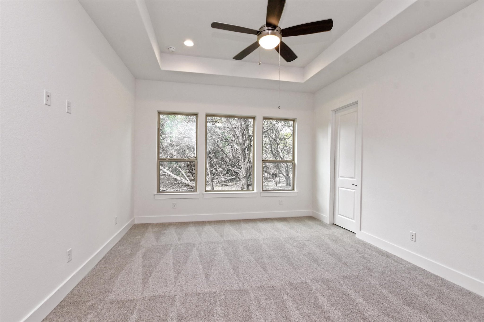 4828 Destination Way Jonestown, TX 78645 - Photo 14 of 33 wooden floor in an empty room with a window