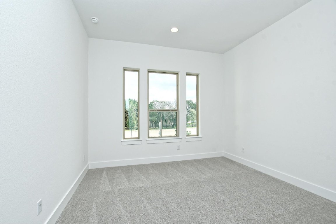 4828 Destination Way Jonestown, TX 78645 - Photo 22 of 33 an empty room with a window