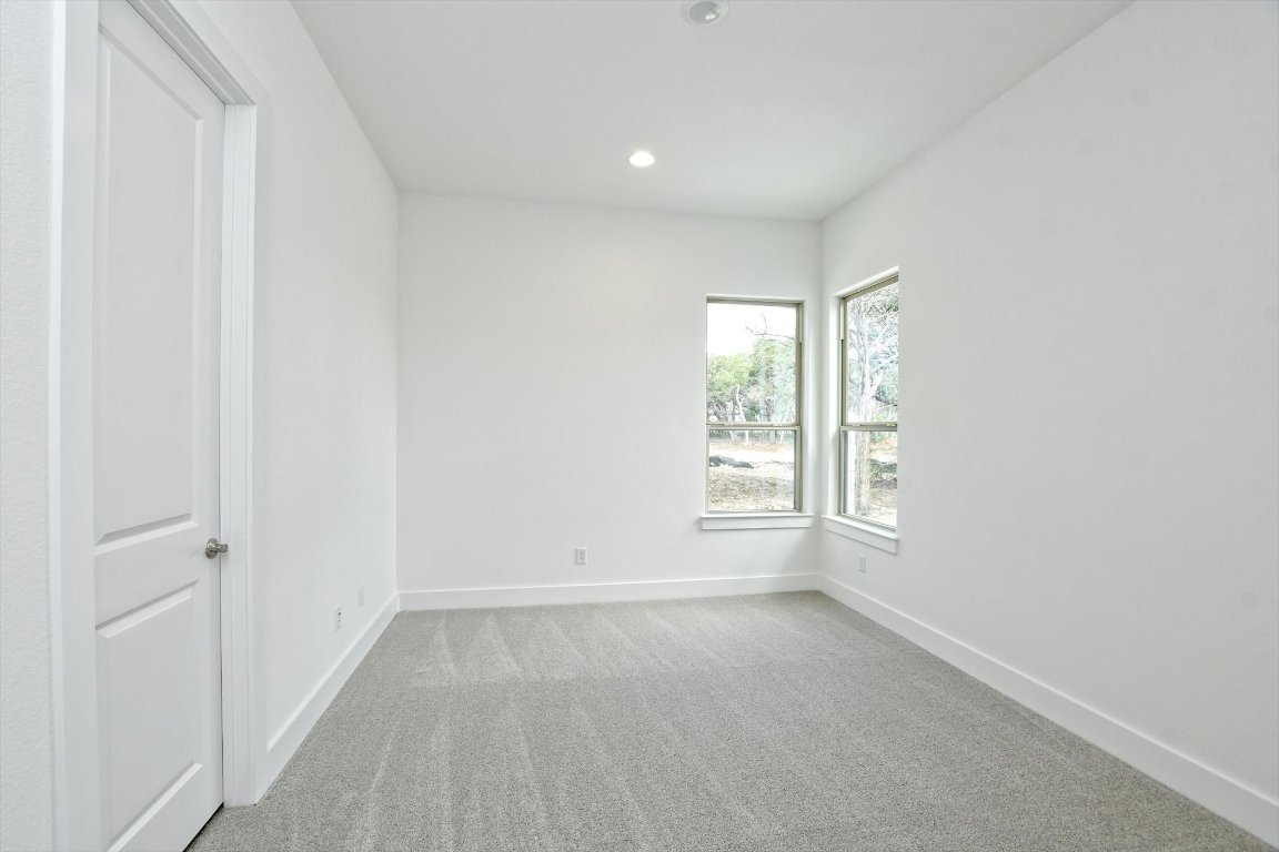 4828 Destination Way Jonestown, TX 78645 - Photo 24 of 33 an empty room with windows