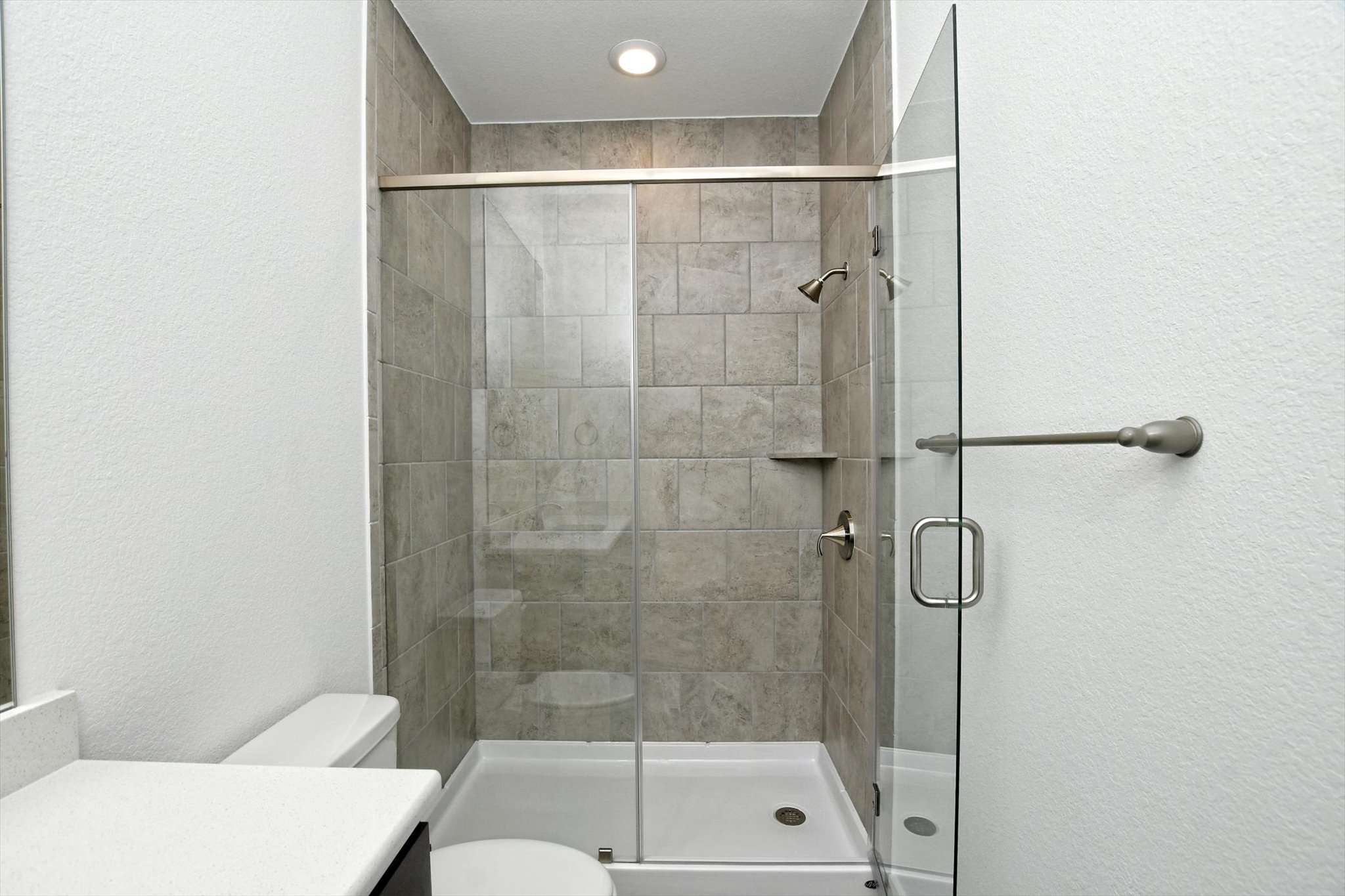 4828 Destination Way Jonestown, TX 78645 - Photo 25 of 33 a bathroom with a shower and toilet