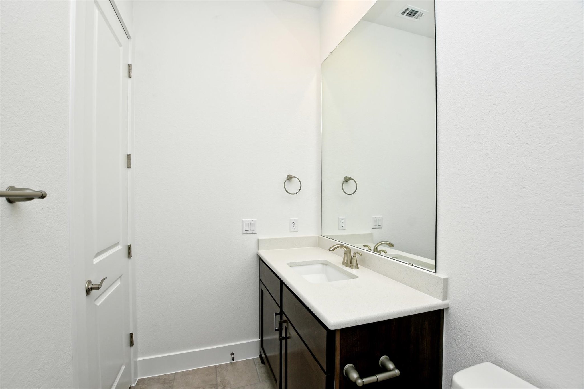 4828 Destination Way Jonestown, TX 78645 - Photo 26 of 33 a bathroom with a sink and a mirror