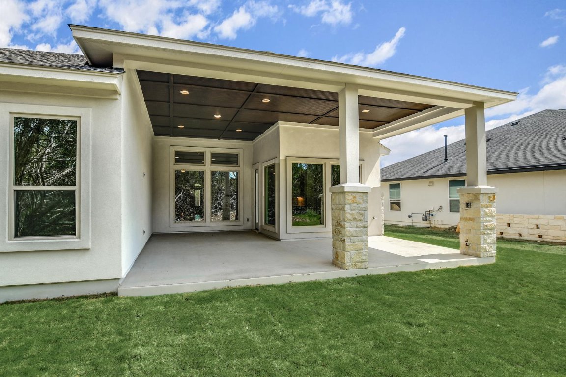 4828 Destination Way Jonestown, TX 78645 - Photo 30 of 33 a view of a house with a porch and furniture