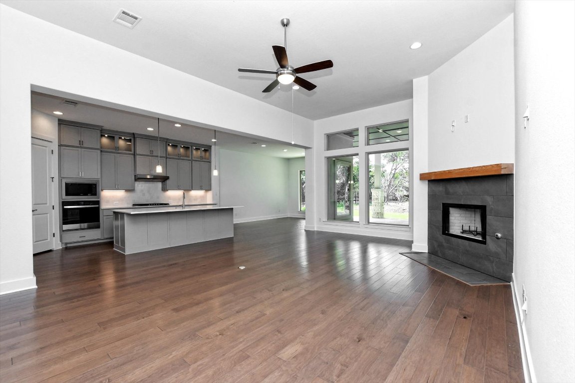 4828 Destination Way Jonestown, TX 78645 - Photo 6 of 33 a view of kitchen with cabinets and wooden floor