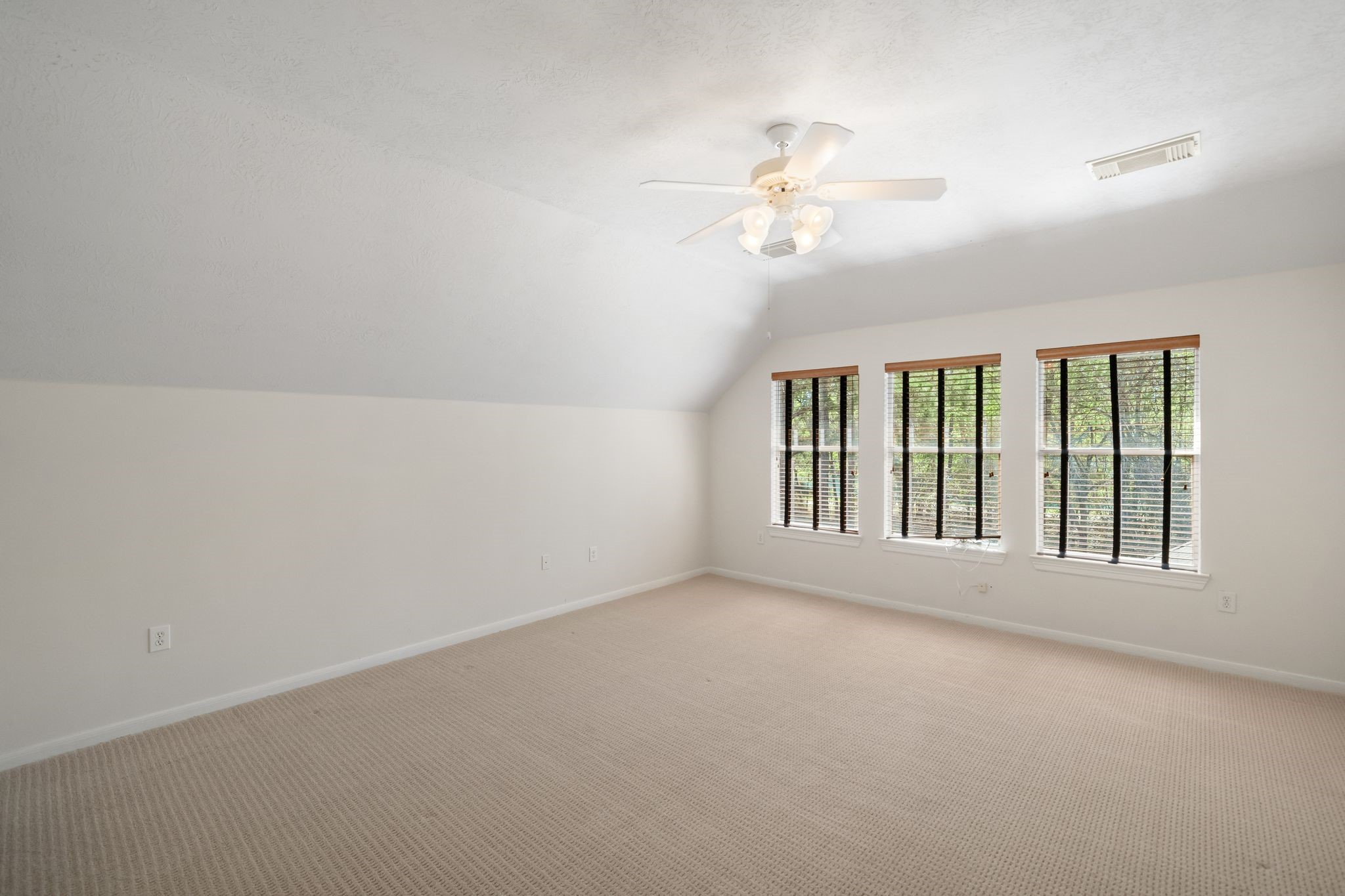 7 Sovereign Way Conroe, TX 77384 - Photo 18 of 31 a view of an empty room with a window