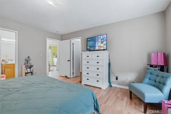 a bedroom with a bed and furniture