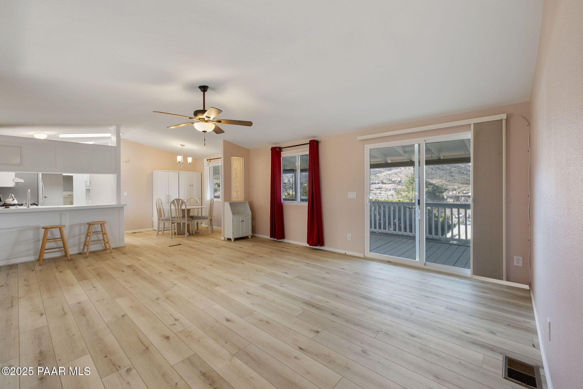 2572 Hilltop Road Prescott, AZ 86301 - Photo 15 of 34 a view of an empty room with glass door and a window