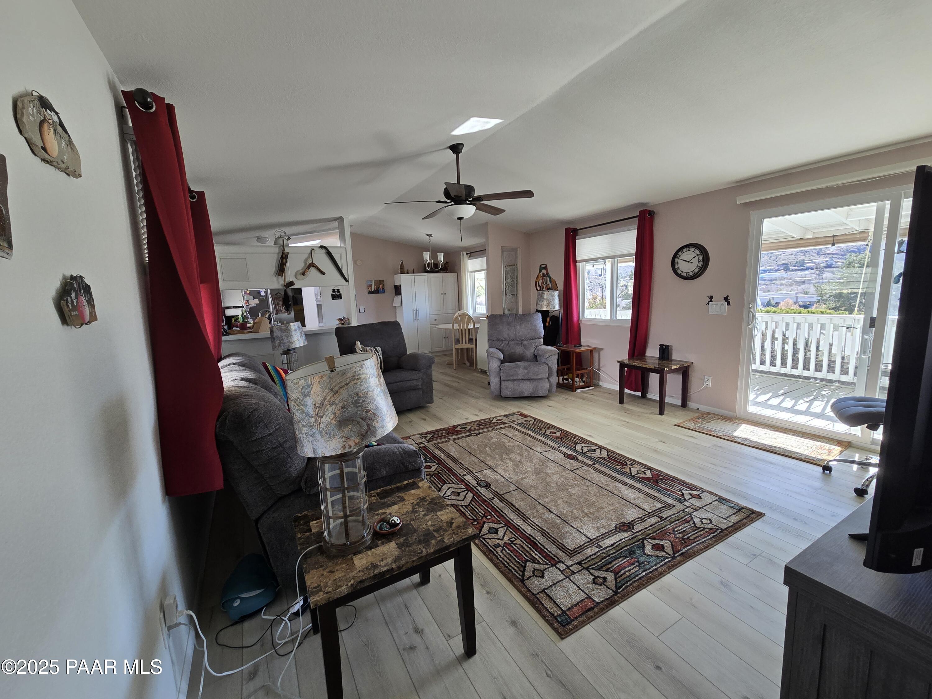 2572 Hilltop Road Prescott, AZ 86301 - Photo 16 of 34 a living room with furniture and a flat screen tv