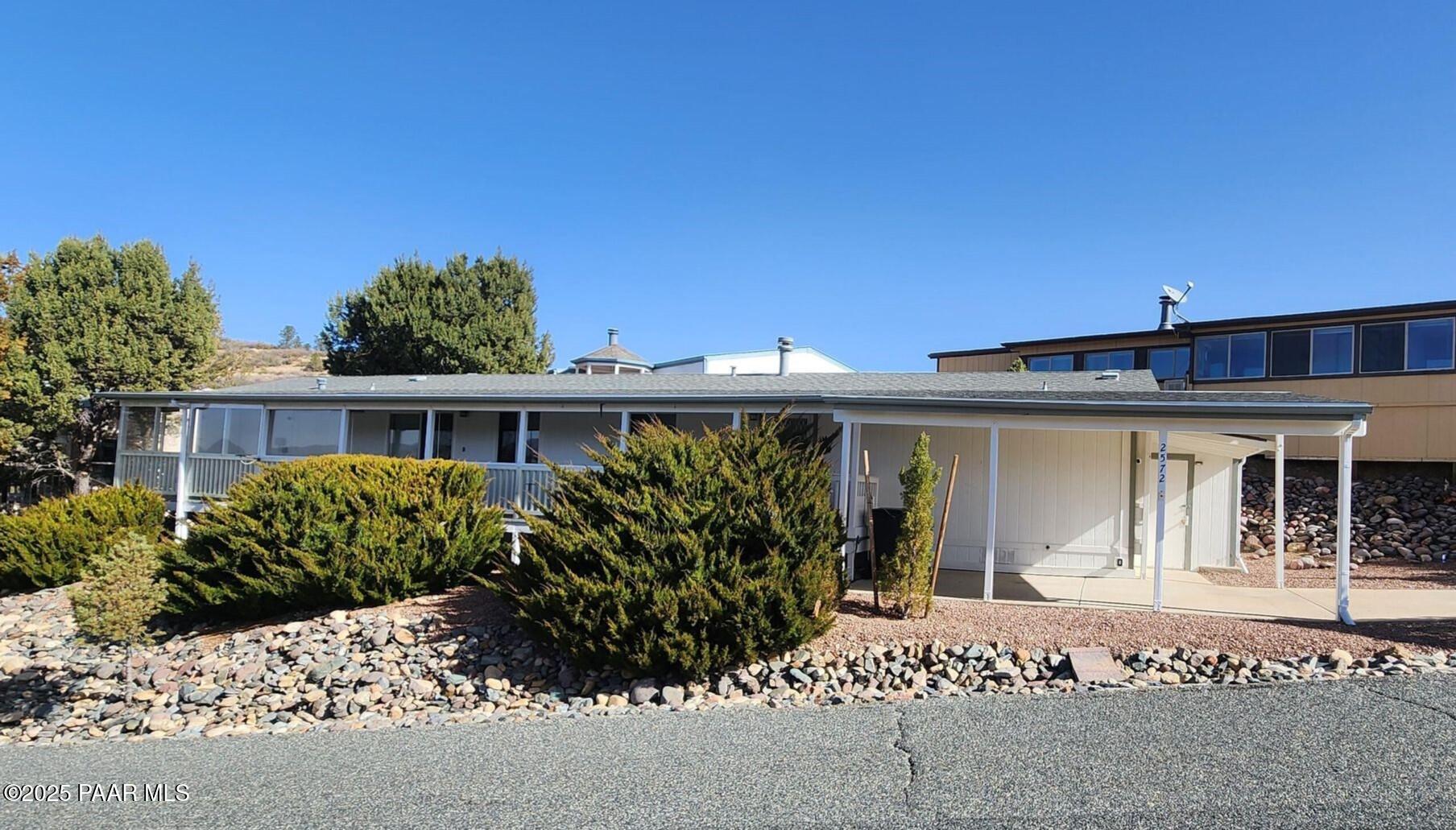 2572 Hilltop Road Prescott, AZ 86301 - Photo 2 of 34 a front view of a house with garden