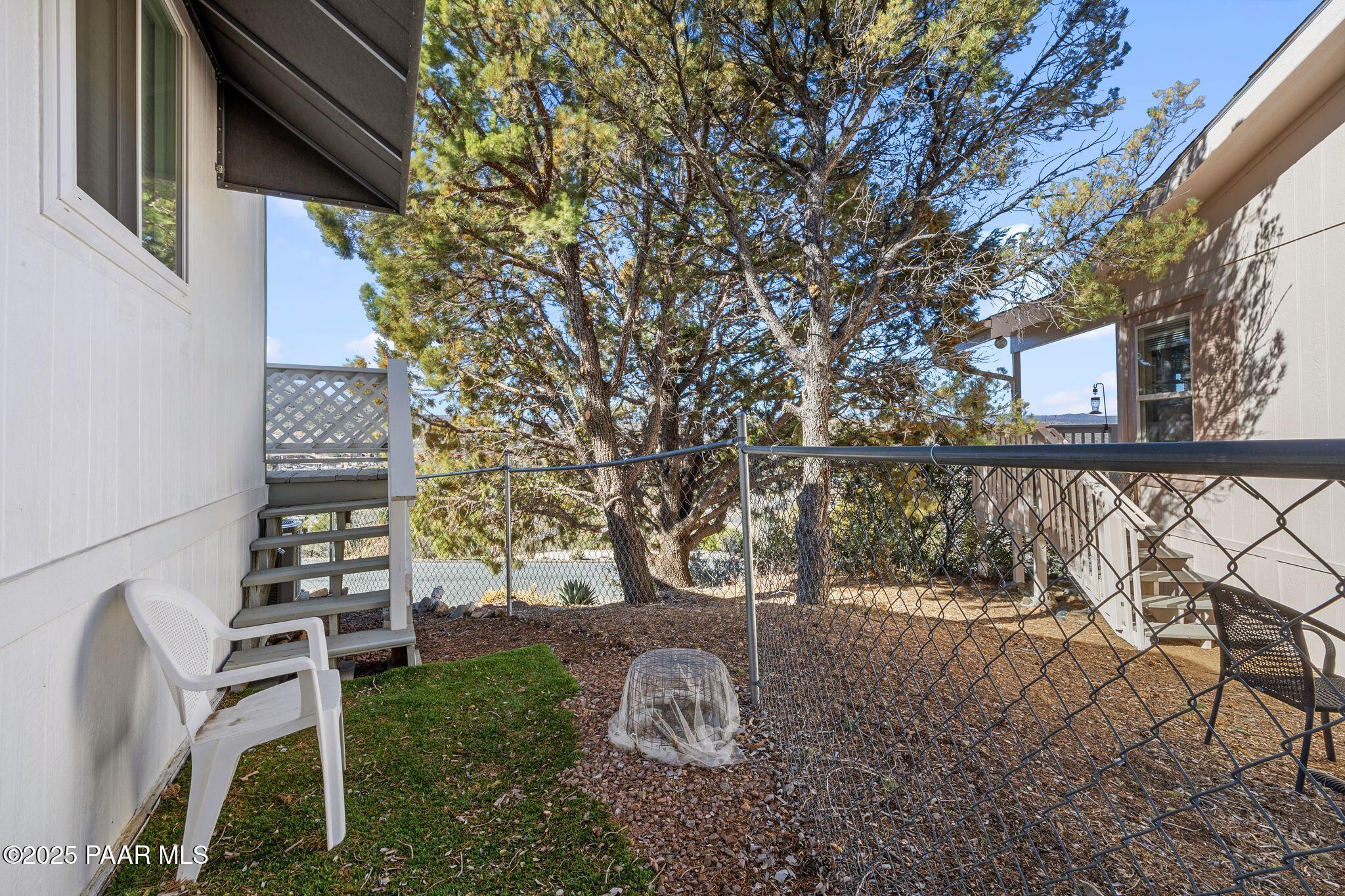 2572 Hilltop Road Prescott, AZ 86301 - Photo 34 of 34 a backyard of a house with lots of green space