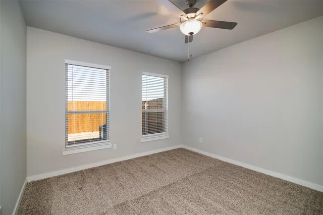 a bathroom with double sink and a mirror