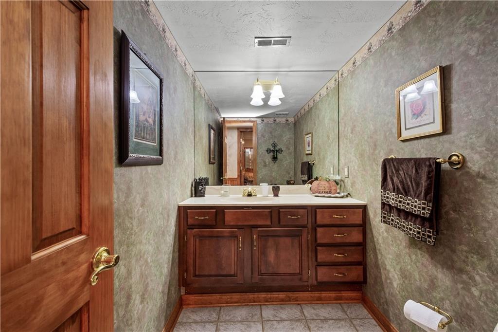 230 Sundust Road Eighty Four, PA 15330 - Photo 22 of 47 a spacious bathroom with a granite countertop sink a mirror and a bathtub
