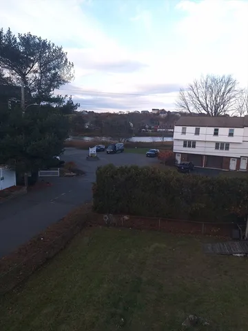 a view of a terrace with a garden and trees