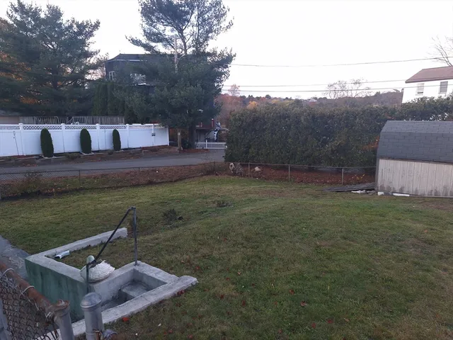 a view of a backyard with sitting area